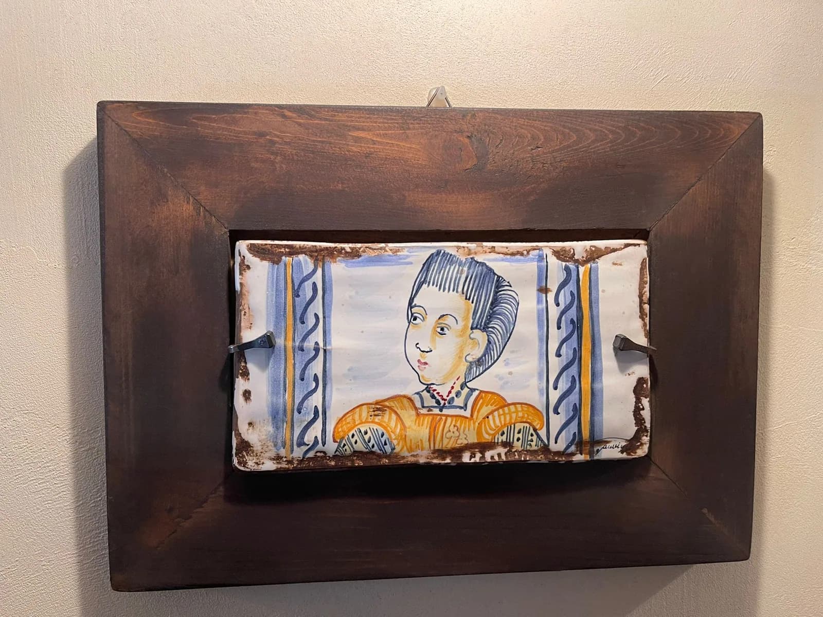Formella con una figura di paggio, in cornice.