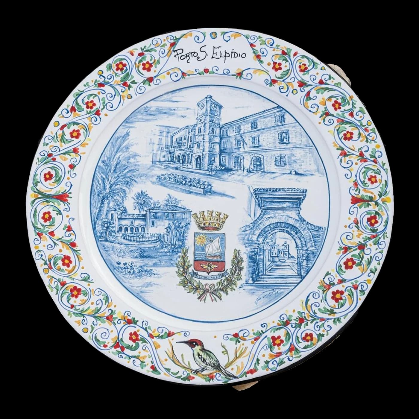 Maiolica plate dedicated to Porto Sant'Elpidio, with the villa, the tower and the arch inside a scrolled border of red and yellow flowers.